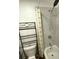 The modern bathroom includes a shower over tub and geometric tiles at 1947 Los Lomas Dr, Clearwater, FL 33763