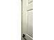 A bathroom doorway with modern fixtures including geometric tiles at 1947 Los Lomas Dr, Clearwater, FL 33763