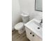 Modern bathroom features a stylish vanity, toilet, and contemporary finishes for a clean look at 1947 Los Lomas Dr, Clearwater, FL 33763