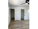 Bedroom with light-colored flooring and large closets at 1947 Los Lomas Dr, Clearwater, FL 33763