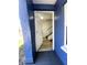 Inviting entryway with open door, showcasing wood-look flooring and the staircase at 1947 Los Lomas Dr, Clearwater, FL 33763