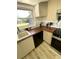 Kitchen with white cabinets, wood counters, and modern appliances at 1947 Los Lomas Dr, Clearwater, FL 33763