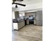 Updated kitchen with wood counters, modern cabinets, stainless steel appliances, and stylish backsplash at 1947 Los Lomas Dr, Clearwater, FL 33763