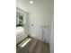 Clean laundry area with hookups, a window and new floors at 1947 Los Lomas Dr, Clearwater, FL 33763