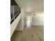 Bright living room featuring wood-look floors and neutral walls with view to backyard at 1947 Los Lomas Dr, Clearwater, FL 33763