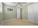 Cozy bedroom with closet and adjacent door with ceiling fan at 2015 Bayshore Gardens Pkwy, Bradenton, FL 34207