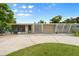 Charming single-story home featuring a minimalist front yard and modern architectural details at 2015 Bayshore Gardens Pkwy, Bradenton, FL 34207