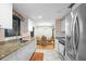 The kitchen has granite countertops, white cabinets, and stainless steel appliances at 2015 Bayshore Gardens Pkwy, Bradenton, FL 34207