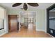 Inviting sunroom with wood floors and views into dining and living areas at 2015 Bayshore Gardens Pkwy, Bradenton, FL 34207