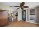Inviting sunroom with wood floors leading to dining and kitchen areas at 2015 Bayshore Gardens Pkwy, Bradenton, FL 34207