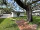Exterior of backyard storage space with outdoor patio and well maintained lawn at 2333 22Nd S St, St Petersburg, FL 33712