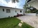 A spacious backyard with a brick patio and stone pavers around the home's exterior at 2333 22Nd S St, St Petersburg, FL 33712