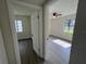 A look through the doorway shows the bedroom has neutral paint, gray flooring, and plenty of natural light at 2333 22Nd S St, St Petersburg, FL 33712