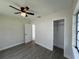 This bedroom has neutral paint, gray flooring, a closet, and plenty of natural light from the two windows at 2333 22Nd S St, St Petersburg, FL 33712