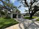 The exterior of this two-car garage has two garage door bays, a walkway and a side entrance door at 2333 22Nd S St, St Petersburg, FL 33712