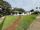 Charming one-story home featuring a brick walkway and lush, green lawn at 2333 22Nd S St, St Petersburg, FL 33712