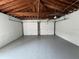 The interior of this two-car garage has painted floors and walls, and two bays for parking vehicles at 2333 22Nd S St, St Petersburg, FL 33712