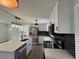 Bright kitchen with island, stainless appliances, black hardware, and modern backsplash at 2333 22Nd S St, St Petersburg, FL 33712