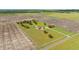 Aerial view of home with surrounding farmland, highlighting the large lot with white perimeter fence and long driveway at 2350 Virgil Hall Rd, Lithia, FL 33547