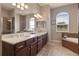 Bathroom featuring dual sinks, granite countertops and tile flooring at 2350 Virgil Hall Rd, Lithia, FL 33547