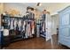 Spacious closet with wood floor, shelving, clothing racks and storage at 2350 Virgil Hall Rd, Lithia, FL 33547