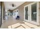 A large covered patio with white doors and views of the pool and an expansive backyard at 2350 Virgil Hall Rd, Lithia, FL 33547