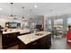 Open kitchen with island, granite counters, stainless appliances, and pendant lighting at 2350 Virgil Hall Rd, Lithia, FL 33547