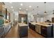 Full kitchen view featuring dual islands, stainless appliances, dark wood cabinetry, and ample counter space at 2350 Virgil Hall Rd, Lithia, FL 33547