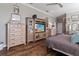 Comfortable main bedroom with ceiling fan and entertainment center at 2350 Virgil Hall Rd, Lithia, FL 33547