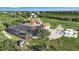 Sprawling property features an enclosed pool, beautiful lawns, and lush vegetation at 2400 Miguel Bay Dr, Terra Ceia, FL 34250