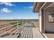 Spacious balcony boasting tiled roof, white rails, and picturesque treetop views at 2400 Miguel Bay Dr, Terra Ceia, FL 34250