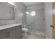 Modern bathroom features a walk-in shower with glass doors and gray vanity at 2400 Miguel Bay Dr, Terra Ceia, FL 34250