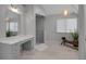 Serene bathroom showcasing a glass enclosed shower, vanity area, and stylish light fixture at 2400 Miguel Bay Dr, Terra Ceia, FL 34250