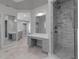 Elegant bathroom featuring dual vanities, glass shower, and recessed lighting at 2400 Miguel Bay Dr, Terra Ceia, FL 34250