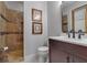 Stylish bathroom featuring tiled shower and modern vanity at 2400 Miguel Bay Dr, Terra Ceia, FL 34250