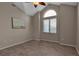 Cozy bedroom with vaulted ceilings, laminate floors and large windows at 2400 Miguel Bay Dr, Terra Ceia, FL 34250
