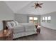 Primary bedroom with gray floors, a ceiling fan, and a sliding glass door to a balcony at 2400 Miguel Bay Dr, Terra Ceia, FL 34250