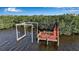 Dock with boat lift provides easy access to the water for boating and fishing at 2400 Miguel Bay Dr, Terra Ceia, FL 34250