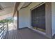 Inviting covered entryway boasting double front doors, deck and neutral colors at 2400 Miguel Bay Dr, Terra Ceia, FL 34250