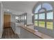 A hallway that features a large arched window and wood-look tile at 2400 Miguel Bay Dr, Terra Ceia, FL 34250