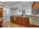 Spacious kitchen featuring an island and granite counters with ample prep space at 2400 Miguel Bay Dr, Terra Ceia, FL 34250