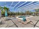 Wide view of the lanai showcasing the pool, patio furniture, and serene outdoor living space at 2400 Miguel Bay Dr, Terra Ceia, FL 34250