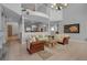 Bright living room area with hardwood floors and lots of natural light from the many windows at 2400 Miguel Bay Dr, Terra Ceia, FL 34250