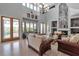 An elegant living room with high ceilings, a fireplace, and multiple sources of natural light at 2400 Miguel Bay Dr, Terra Ceia, FL 34250