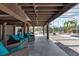 Spacious covered patio with outdoor seating and view of the pool area enclosed within the lanai at 2400 Miguel Bay Dr, Terra Ceia, FL 34250