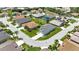 A real estate aerial view showcases a residential neighborhood with well-maintained landscaping and paved streets at 24512 Bramhope Ct, Punta Gorda, FL 33980