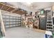 Spacious garage equipped with storage shelves, cabinets, and a workbench at 24512 Bramhope Ct, Punta Gorda, FL 33980