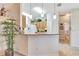 Modern kitchen with granite countertop bar overlooking the adjacent rooms, perfect for entertaining at 24512 Bramhope Ct, Punta Gorda, FL 33980