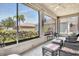 Screened patio with wicker furniture offering a pleasant outdoor seating area at 24512 Bramhope Ct, Punta Gorda, FL 33980
