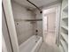 Bathroom showcasing a tub/shower with tiled walls and modern fixtures at 2720 12Th Ave W, Bradenton, FL 34205